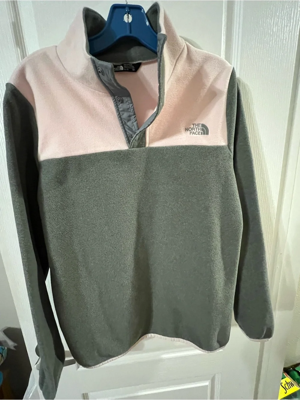 The North Face Girls' Fleece Pullover in grey and pink.
